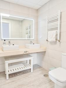 a bathroom with a sink and a mirror at The Garden House in Alicante +33 photos