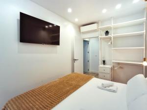 A bed or beds in a room at AKURA apartment, con aire acondicionado
