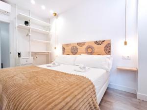 A bed or beds in a room at AKURA apartment, con aire acondicionado
