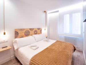 A bed or beds in a room at AKURA apartment, con aire acondicionado