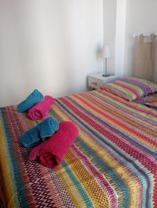 a bedroom with two towels on a bed at Le Fontana in Nice