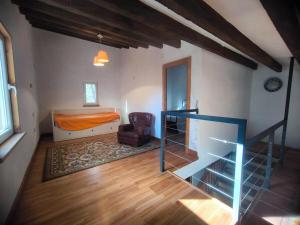 a bedroom with a bed and a desk and a chair at Beautiful mountain chalet in Siete Aguas +27 photos