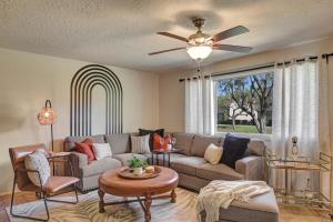 a living room with a couch and a ceiling fan at Osborn in Scottsdale