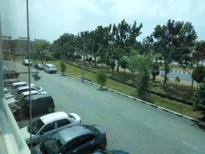 a view of a parking lot with cars parked at Vista Vacation Homestay in Melaka