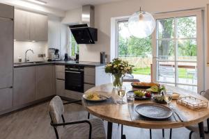 a kitchen with a wooden table with food on it at Schmalfelden No 95 in Schmalfelden
