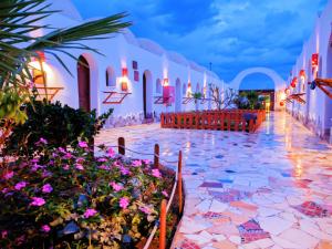 a wedding venue with flowers in the aisle at Ghazala hotel dahab in Dahab