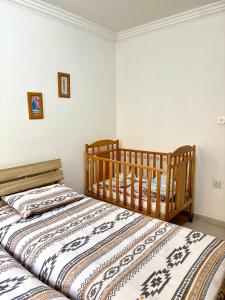 two beds sitting next to each other in a bedroom at Mellieha Seaside Apartment in Mellieħa