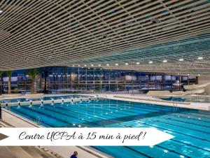 a large swimming pool with a large swimming pool at L'Éclat Champenois - Terrasse-Gare-Arena in Reims