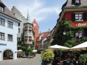 a street in a town with a clock tower at Apartment in Meersburg by Lake Constance in Meersburg