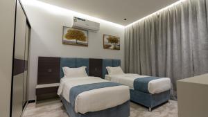 Katil atau katil-katil dalam bilik di فندق قمم بارك Qimam Park Hotel 9 +58 gambar