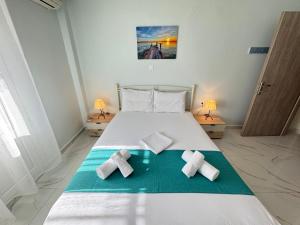 Ένα ή περισσότερα κρεβάτια σε δωμάτιο στο Dimado 4