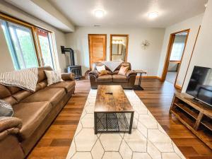 a living room with a couch and a coffee table at Secluded Cabin_fishing_hiking_relaxing_fireplace in Florissant