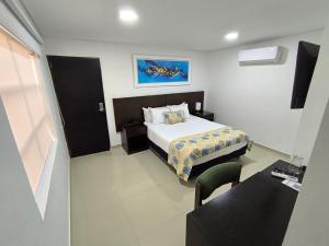 Postel nebo postele na pokoji v ubytování San Martin Cartagena