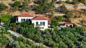 an aerial view of a white house with red roof at Ktima Pyroessa Apartments - Yellow Apartment in Thános