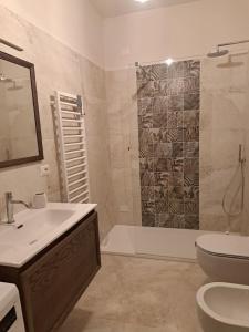 a bathroom with a shower and a sink and a toilet at casa Marino in Tuoro sul Trasimeno