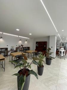 TV a/nebo společenská místnost v ubytování Universitario Hotel