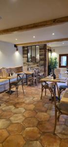 a dining room with wooden tables and chairs at U PASTURELLU in Pioggiola +41 photos