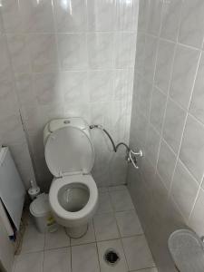 a small bathroom with a toilet in a stall at Floisvos Apartments in Selianitika +10 photos