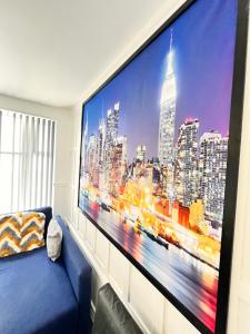 a large flat screen tv on a wall in a living room at The Brooklyn loft apartment in Blackpool +6 photos
