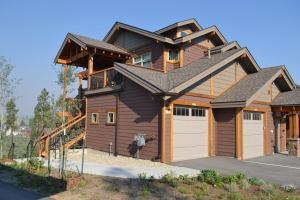 a large house with a gambrel at Luxury condo with stunning views! in Fraser