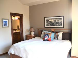 a bedroom with a bed and a mirror at Luxury condo with stunning views! in Fraser