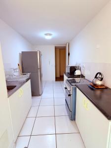 Kuchyň nebo kuchyňský kout v ubytování Acogedor Departamento en Lima