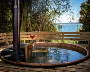 a circular pond with a fence and water in it at La Casa de Alerce in Chacao