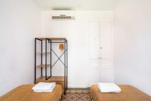 Ein Bett oder Betten in einem Zimmer der Unterkunft Sagrada Familia- Emblematic and Charming Catalan Home