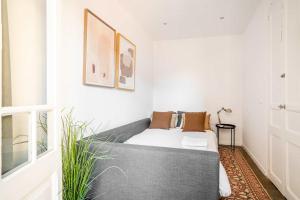 Ein Bett oder Betten in einem Zimmer der Unterkunft Sagrada Familia- Emblematic and Charming Catalan Home
