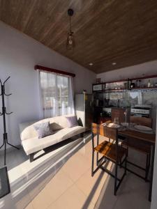 a living room with a couch and a table at Cabina Hermanas Valencia in Monteverde Costa Rica