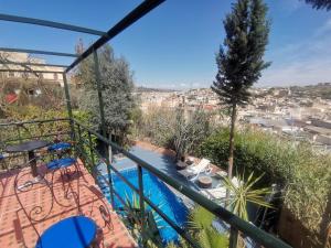 a balcony with a view of the city at Studio avec piscine et parking prive in Fès +10 photos