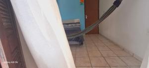 a hallway with a rope leading to a room at Casa bougainville in Caucaia