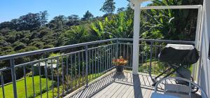 a balcony with a vase of flowers on it at Deluxe Seaview Chalet 6 by Palm Beach Chalets in Palm Beach