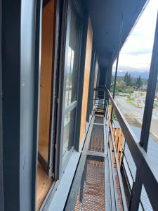 an empty balcony of a building with a window at Departamentos en Villa La Angostura con ubicación ideal in Villa La Angostura
