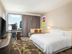 a hotel room with a large bed and a television at The Westin Cleveland Downtown in Cleveland +81 photos