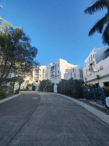 an empty street in front of some buildings at JnF Suites Tagaytay in Tagaytay