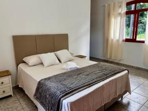 Postel nebo postele na pokoji v ubytování Espaçosa casa no centro de Pomerode Lar Pomerano