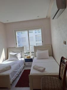 Ένα ή περισσότερα κρεβάτια σε δωμάτιο στο les sables d'or