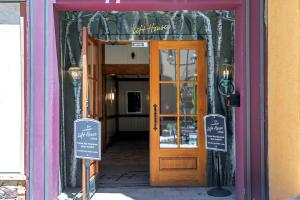 a doorway to a store with a wooden door at Lift House Lodge, Remodeled Downtown Lionshead Studio Condo in Vail