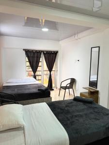 Postel nebo postele na pokoji v ubytování El guadual apartahotel