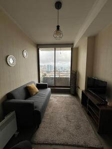 TV a/nebo společenská místnost v ubytování Depto completo un dormitorio concepción