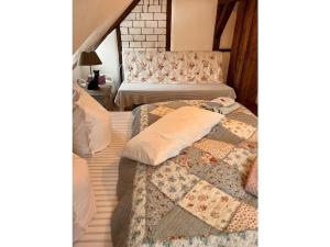 Giường trong phòng chung tại Holiday home Schwarzer Kater