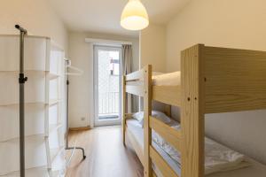 a room with two bunk beds and a light at Horizon 0501 P in Sint-Idesbald