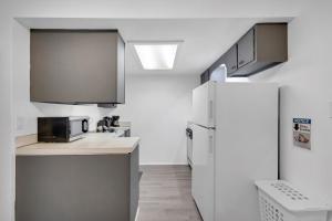 a kitchen with a refrigerator and a sink at Central Bellevue Retreat in Bellevue