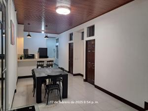 a kitchen and dining room with a table and chairs at Isabella House, Beautiful views of the mountains in Matagalpa +41 photos