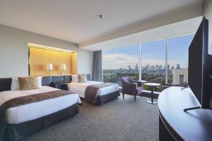 Postel nebo postele na pokoji v ubytování Hotel New Otani Tokyo The Main