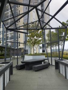 a group of benches in a building with windows at The Luxe Lodge 2BR Apartment Southville City Bangi in Bangi