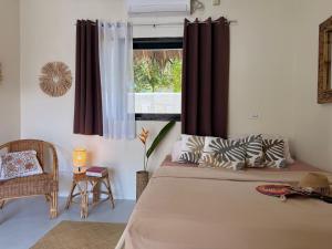 Postel nebo postele na pokoji v ubytování Parrots Boutique Resort