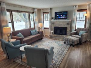 a living room with a couch and a fireplace at My Roam'n Empire - Super Cute With Toys! in Empire