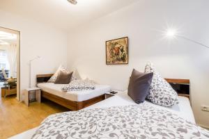 מיטה או מיטות בחדר ב-Ferien Und Messewohnug